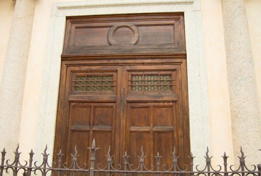 Old vintage oak door in the Church, close-up.