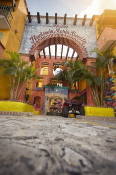 A colorful entrance to a Mexican hotel in the center of Playa del Carmen