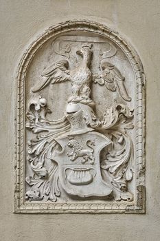 Bas-relief in the Form of a Coat of Arms on the Wall of an Old Building