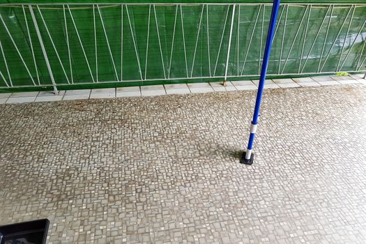 Balcony floor tiles installation. Laying tiles from porcelain. Interior remodeling theme.