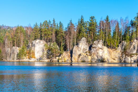 Natural lake in Adrspach rocks on sunny autumn day. Adrspach-Teplice sandstone rock town, Czech Republic.