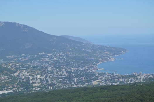 Panorama of the resort city of Yalta from AI-Petri mountain, Russia, Crimea, 01.06.2018.