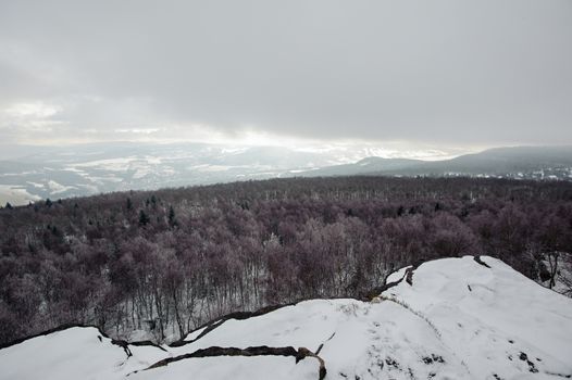 Winter landscape covered with snow and snow clouds