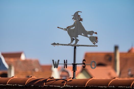 View to a witch on the roofs of town Noerdlingen in Germany in Summer