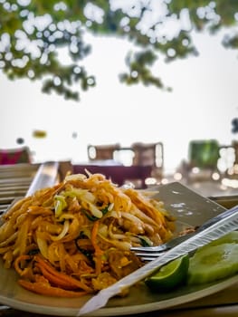 Pad Thai on table at the beach