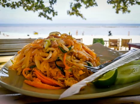 Pad Thai on table at the beach