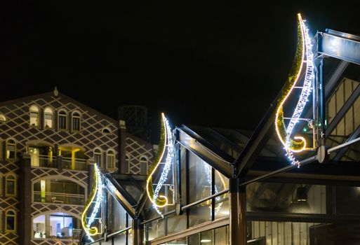 beautiful christmas light decorations on buildings to decorate the city streets at night