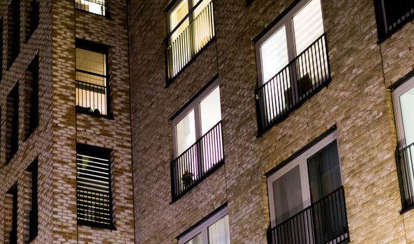 city windows at night modern dutch architecture background