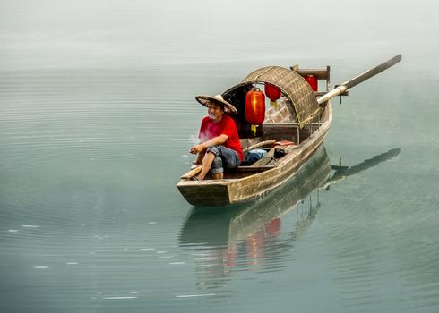 A fisherman in the famous Misty Small Dongjiang (east river) in Chenzhou, Hunan province of China.