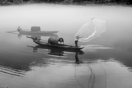 A fisherman in the famous Misty Small Dongjiang (east river) in Chenzhou, Hunan province of China.