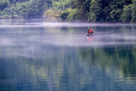 A fisherman in the famous Misty Small Dongjiang (east river) in Chenzhou, Hunan province of China.