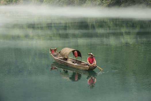 A fisherman in the famous Misty Small Dongjiang (east river) in Chenzhou, Hunan province of China.