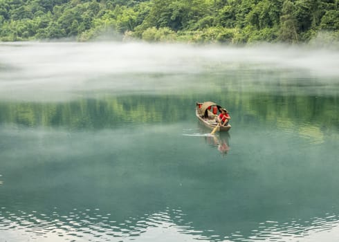 A fisherman in the famous Misty Small Dongjiang (east river) in Chenzhou, Hunan province of China.