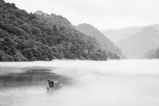 A fisherman in the famous Misty Small Dongjiang (east river) in Chenzhou, Hunan province of China.