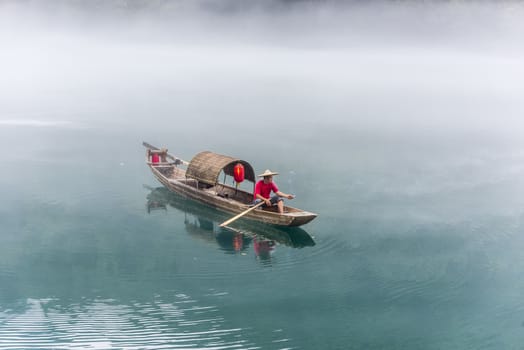 A fisherman in the famous Misty Small Dongjiang (east river) in Chenzhou, Hunan province of China.