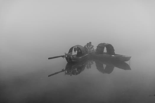 The fisherman in the famous Misty Small Dongjiang (east river) in Chenzhou, Hunan province of China.