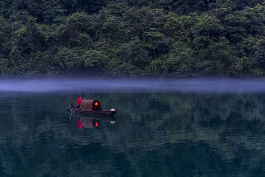 A fisherman in the famous Misty Small Dongjiang (east river) in Chenzhou, Hunan province of China.