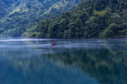 A fisherman in the famous Misty Small Dongjiang (east river) in Chenzhou, Hunan province of China.