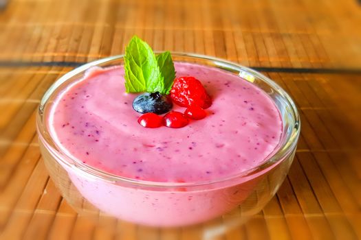 Low calorie food. Fresh healthy blueberries raspberries and redcurrants smoothie