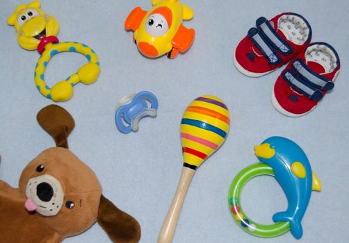 Table top view decoration baby shoes and toys. Flat lay, copy space