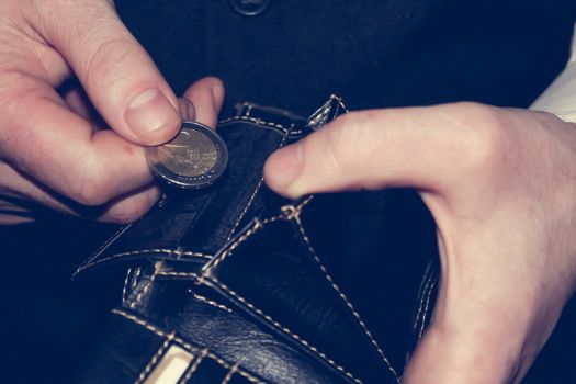 man hand holding a coins, finance concept, counting