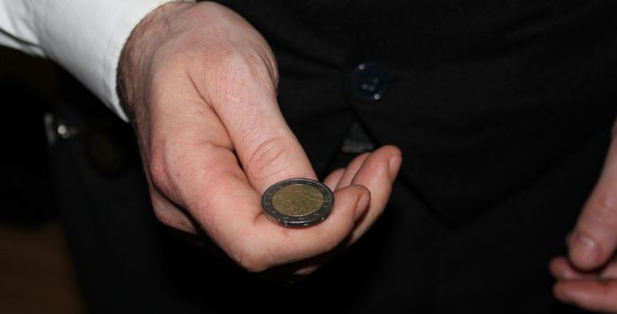 man hand holding a coins, finance concept, counting