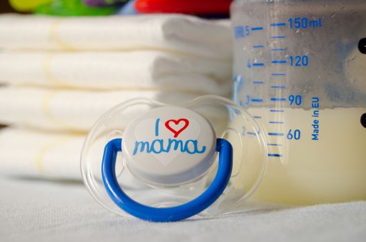 expresed milk 5 days after mother delivered baby, colostrum changing to a milk, breastfeeding concept