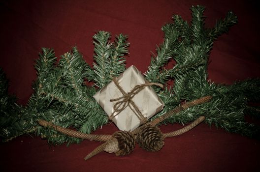 christmas decoration made from christmas tree and gift box on red background