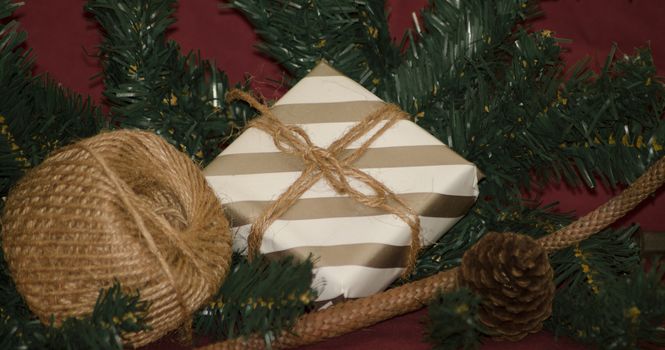 christmas decoration made from christmas tree and gift box on red background