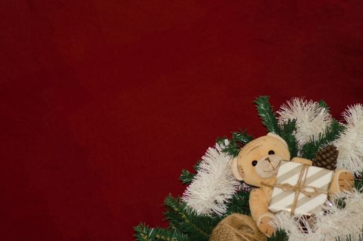 merry christmas postcard design with teddy bear and gift box red