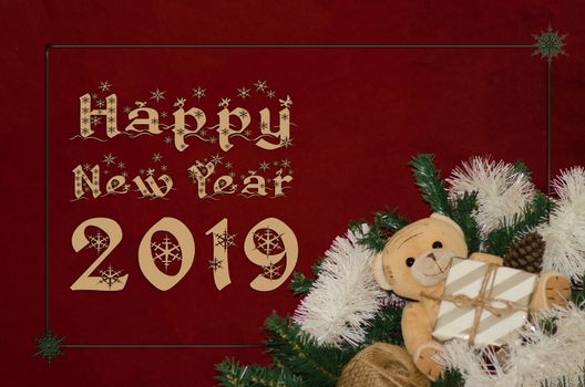 Happy new year 2019 red background with gift box and teddy bear