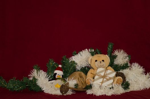 merry christmas postcard design with teddy bear and gift box red