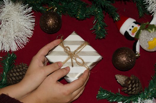 christmas decoration made from christmas tree and gift box on red background