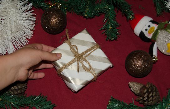 christmas decoration made from christmas tree and gift box on red background