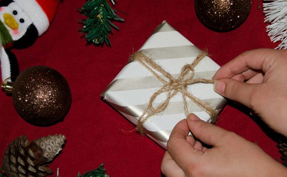 christmas decoration made from christmas tree and gift box on red background