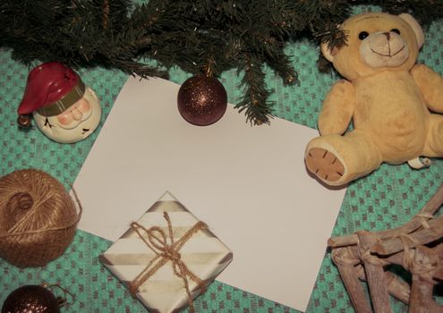 christmas decoration made from christmas tree and gift box on green background