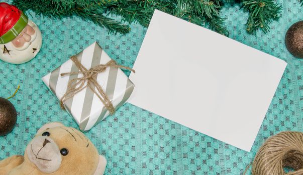 christmas decoration made from christmas tree and gift box on green background