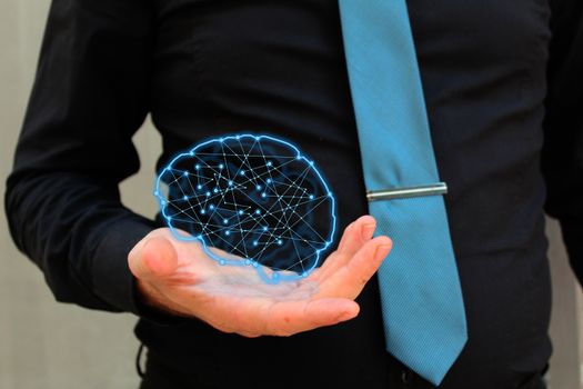Man holding glowing polygonal brain . Artificial intelligence and mind concept. No face