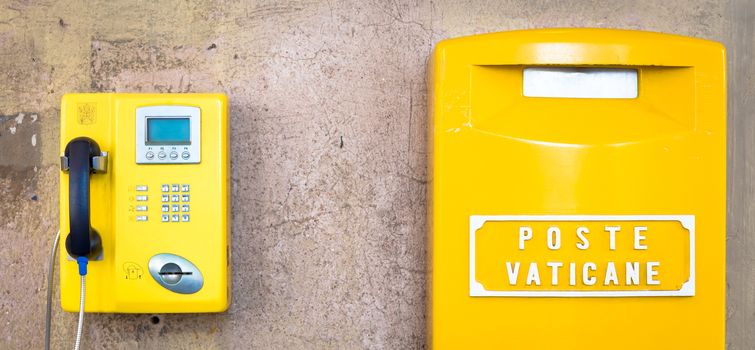 Detail of the traditional yellow post box in Vatican City, Rome