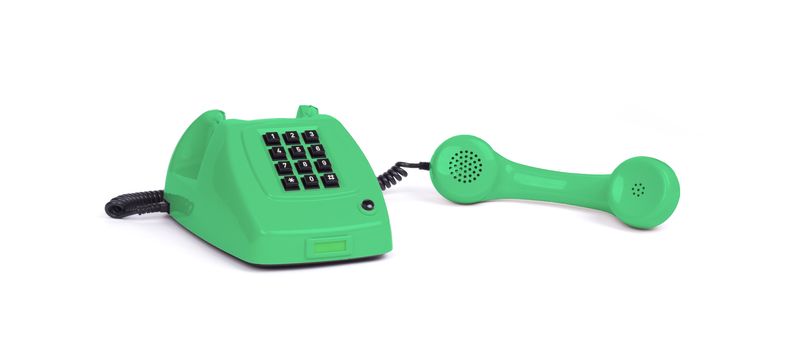 Vintage green telephone with a white background