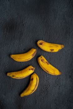 Overripe  bananas on dark background.