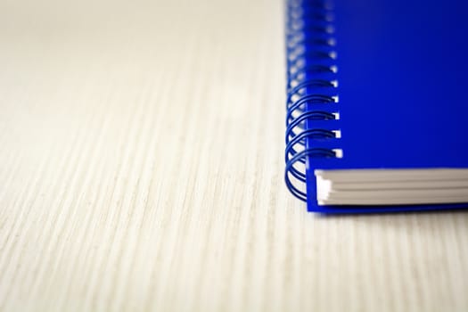 Spiral notebook isolated on a white table. Business and productivity concept. Spiral binding, stationery product