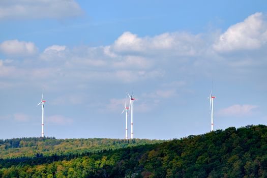 Field of energy windmills in a forest in Germany