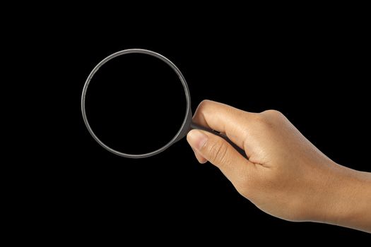 Magnifying glass in man hand isolated on black background, clipping path