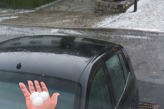 Big hail ice balls on car hood after a heavy hail storm
