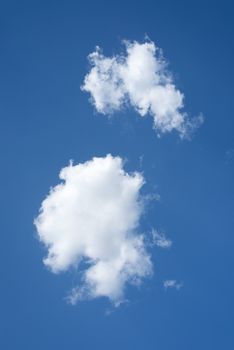Two white clouds on blue sky. Template for your design