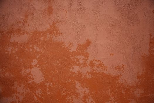 Red wall with texture, wall detail painted on the outside