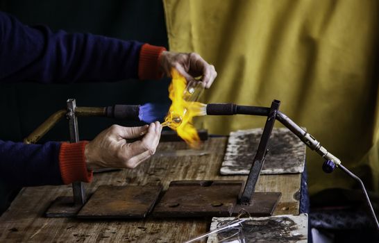 Blowing glass with fire in a traditional way