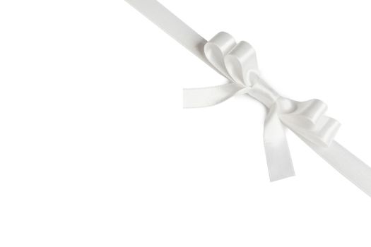 Shiny white satin ribbon and bow isolated on white background. Holiday gift concept