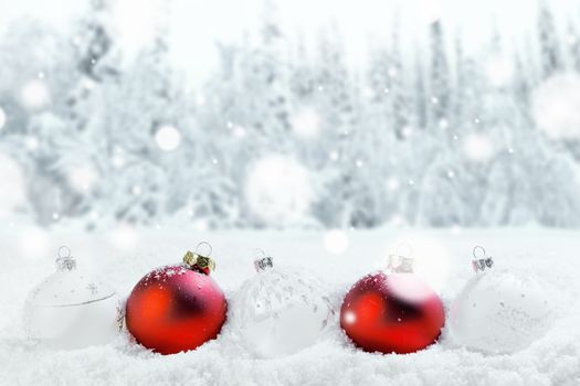 Merry Christmas and Happy New Year greeting card with balls in a row and falling snow . Background with copy space .